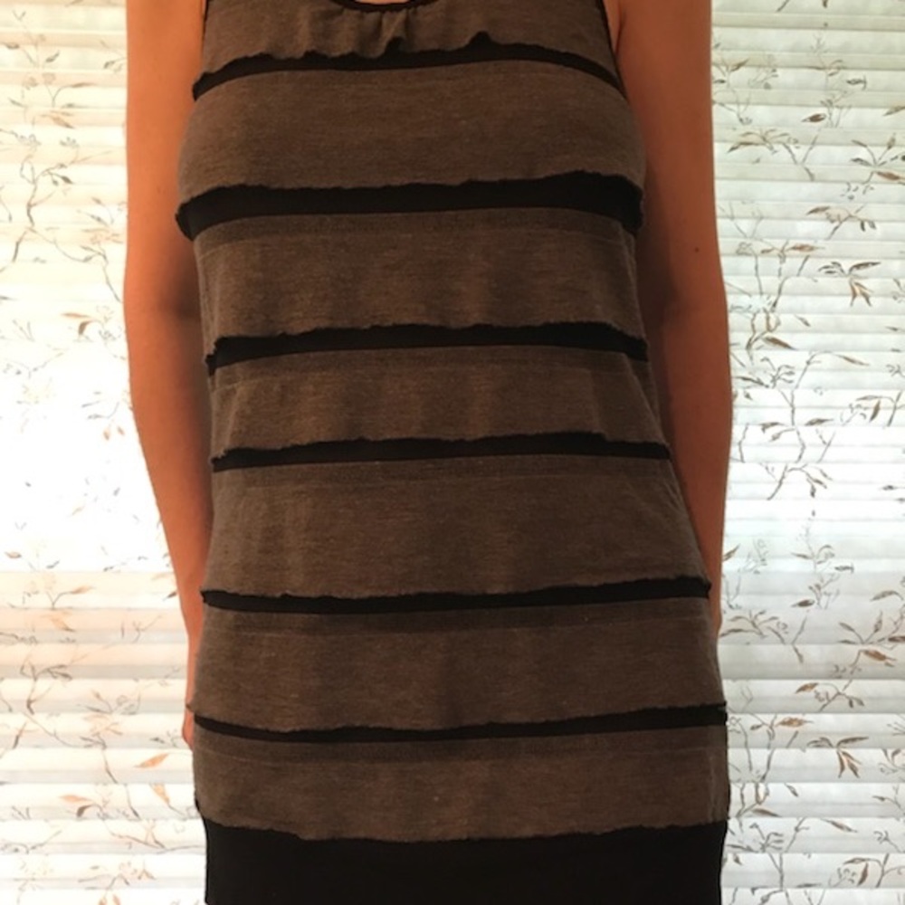 A sleeveless black and grey ruffled top